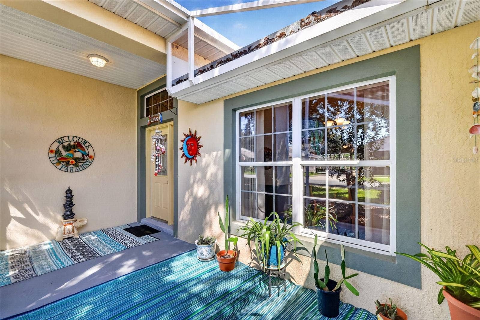6121 HUNTERS RIDGE AVENUE, Leesburg, FL 34748 Charming Front Entry with Extended Birdcage
