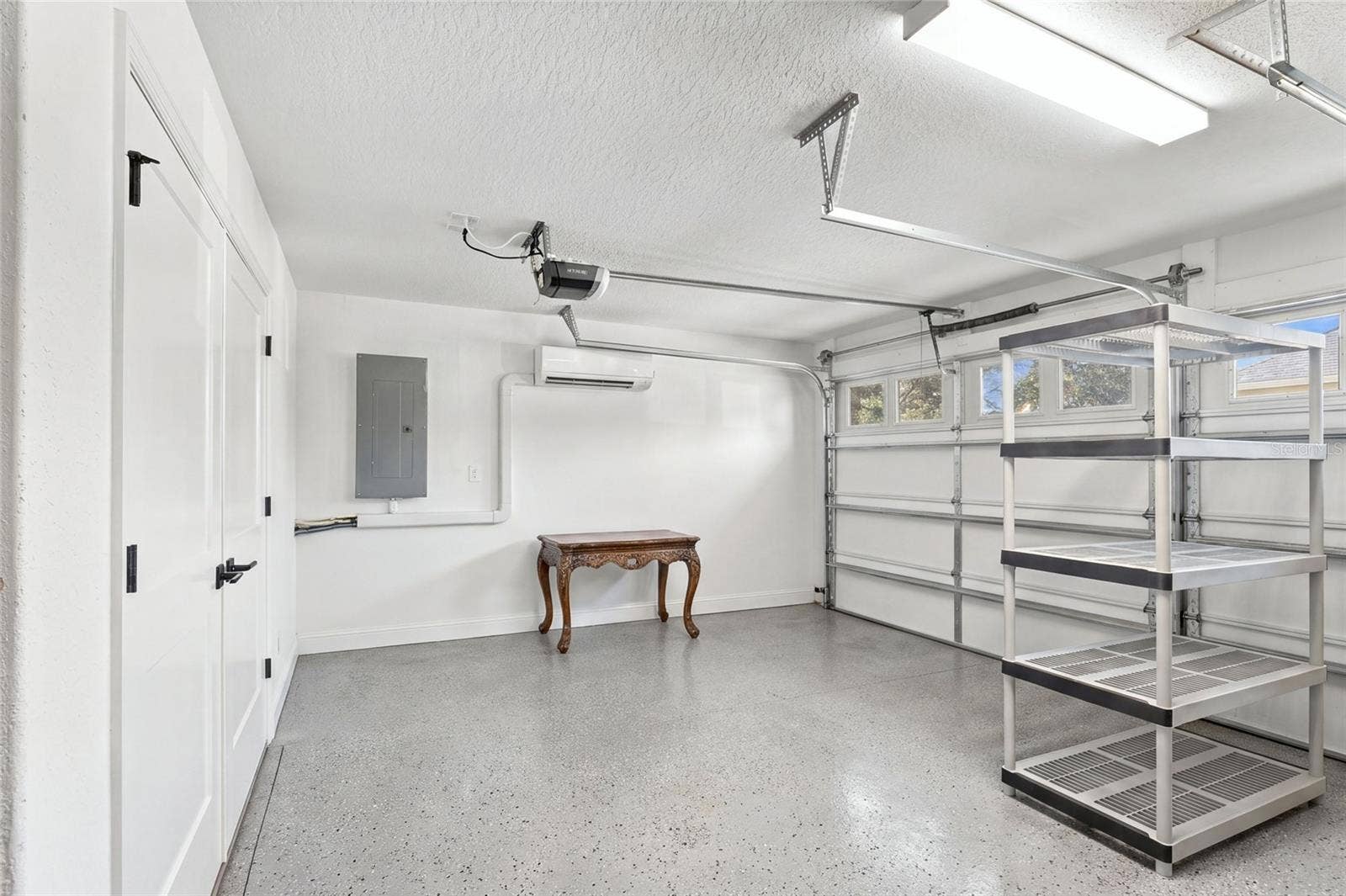 614 LAKE CREEK CIRCLE, The Villages, FL 34762 Garage's Got Cart area with utility closet to left