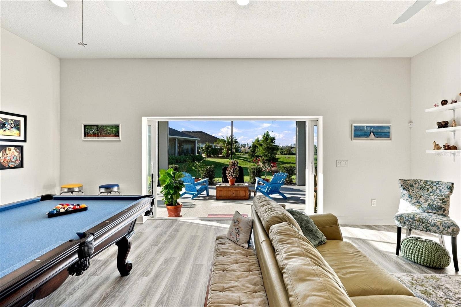 614 LAKE CREEK CIRCLE, The Villages, FL 34762 Living room toward Lanai