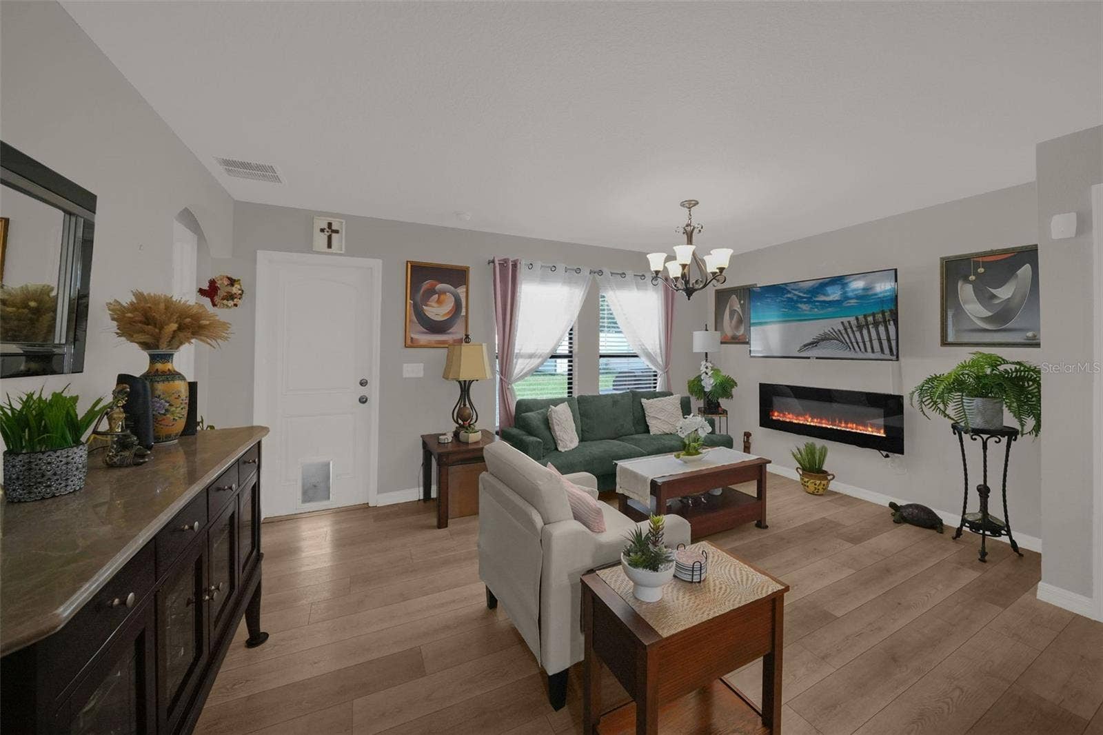 26448 BERTRAM ROAD, Brooksville, FL 34602 Living room with built-in electric fireplace