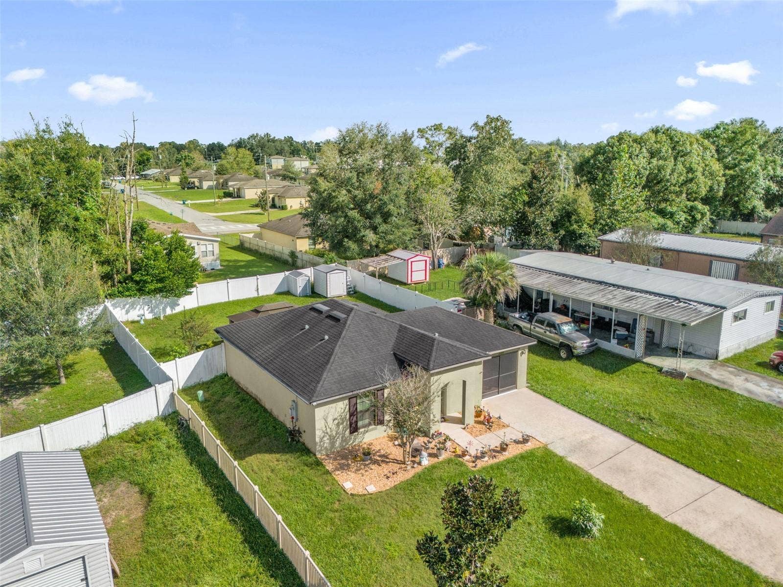 26448 BERTRAM ROAD, Brooksville, FL 34602 Aerial view of home and fenced backyard