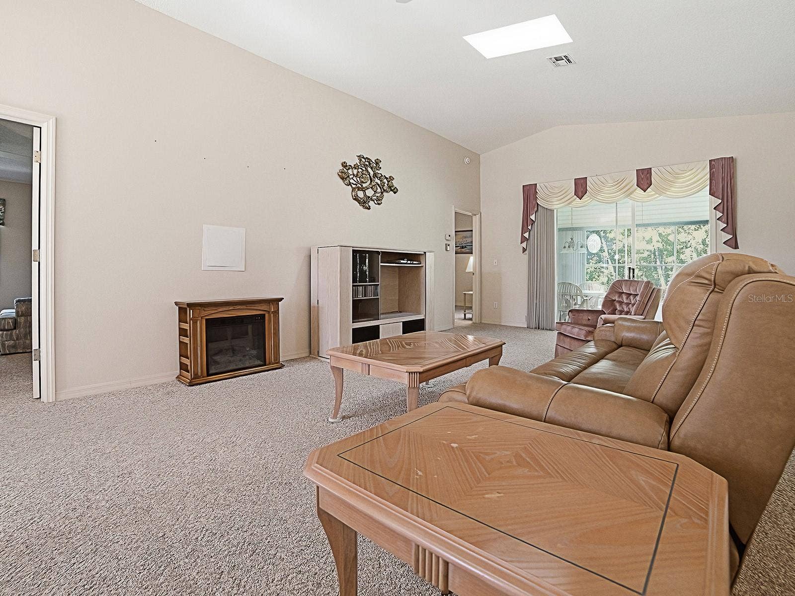 424 RANCHWOOD DRIVE, Leesburg, FL 34748 VIEW WITH SLIDERS TO THE LANAI