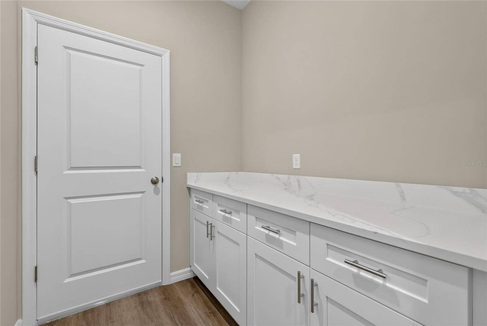 41428 ROYAL TRAILS ROAD, Eustis, FL 32736 Folding area with cabinets and door leads to garage