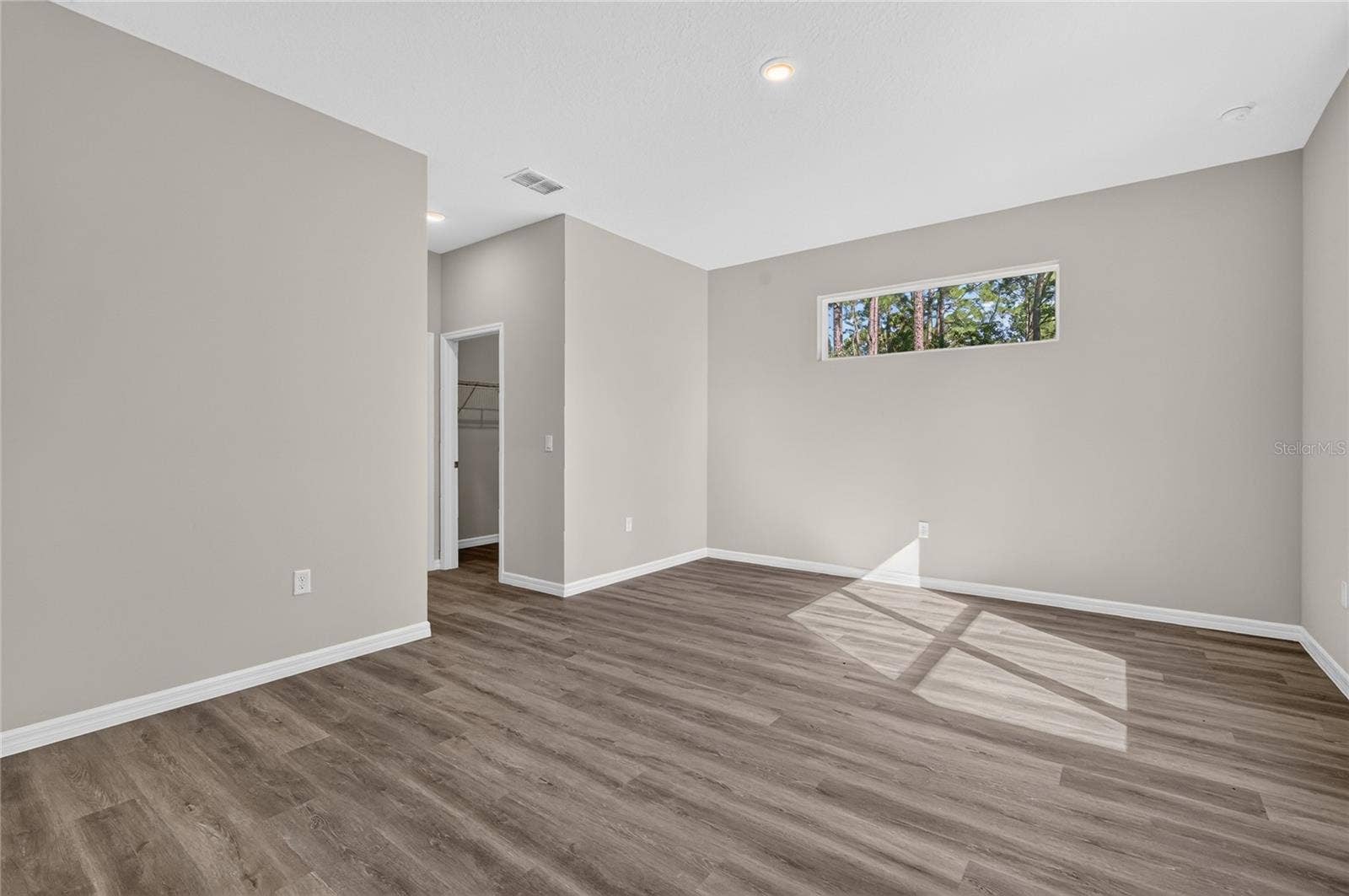 41428 ROYAL TRAILS ROAD, Eustis, FL 32736 Primary bedroom with dual walk in closets