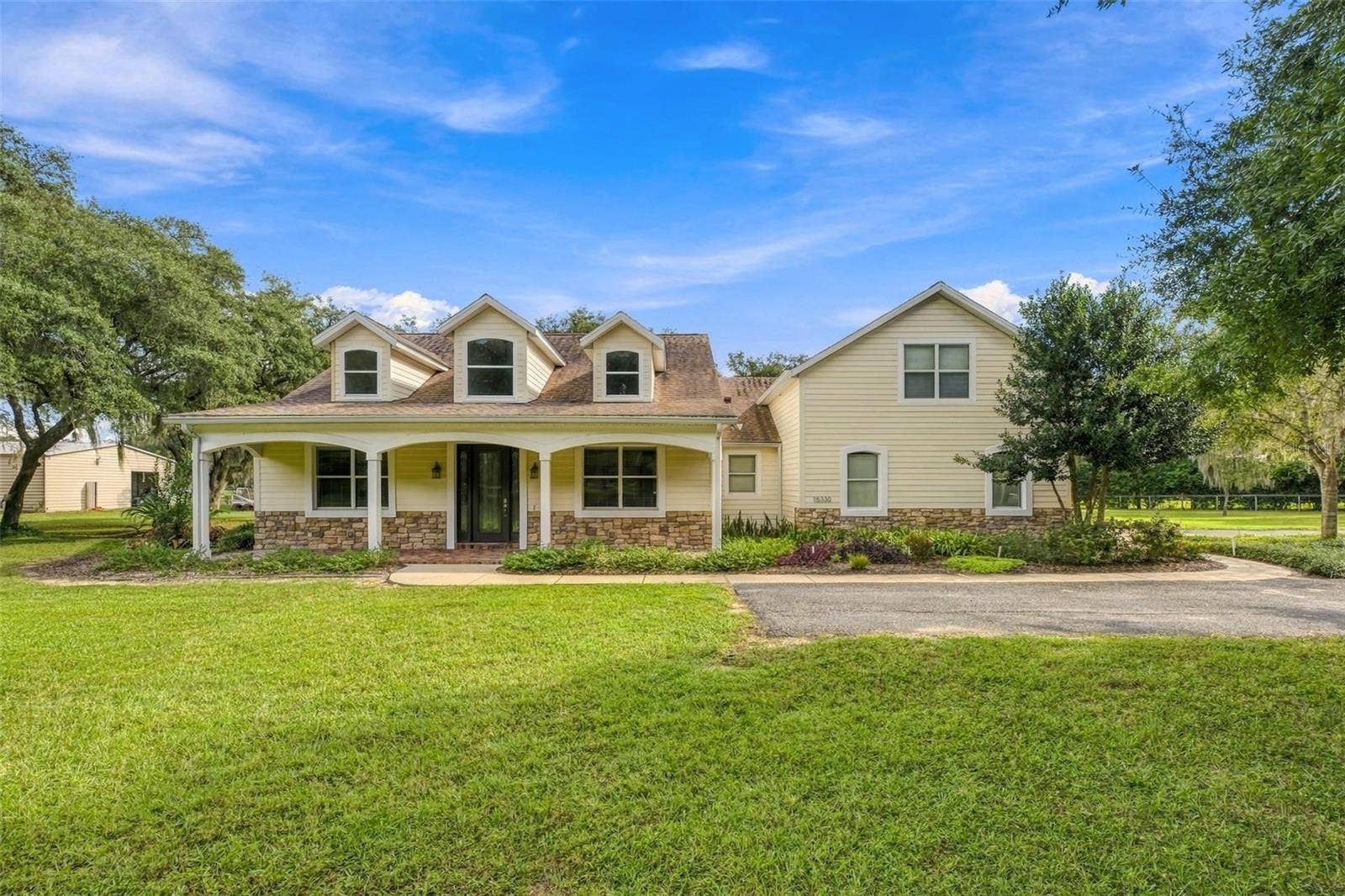 15330 SKY LAKE LANE, Tavares, FL 32778 FRONT EXTERIOR