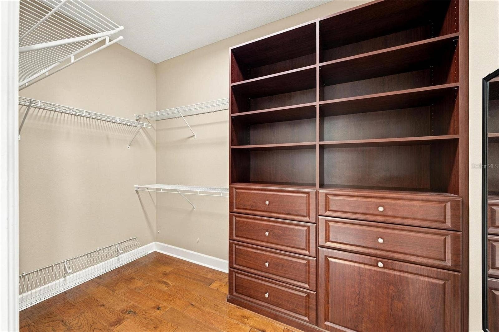 15330 SKY LAKE LANE, Tavares, FL 32778 PRIMARY SUITE CUSTOM CLOSET.