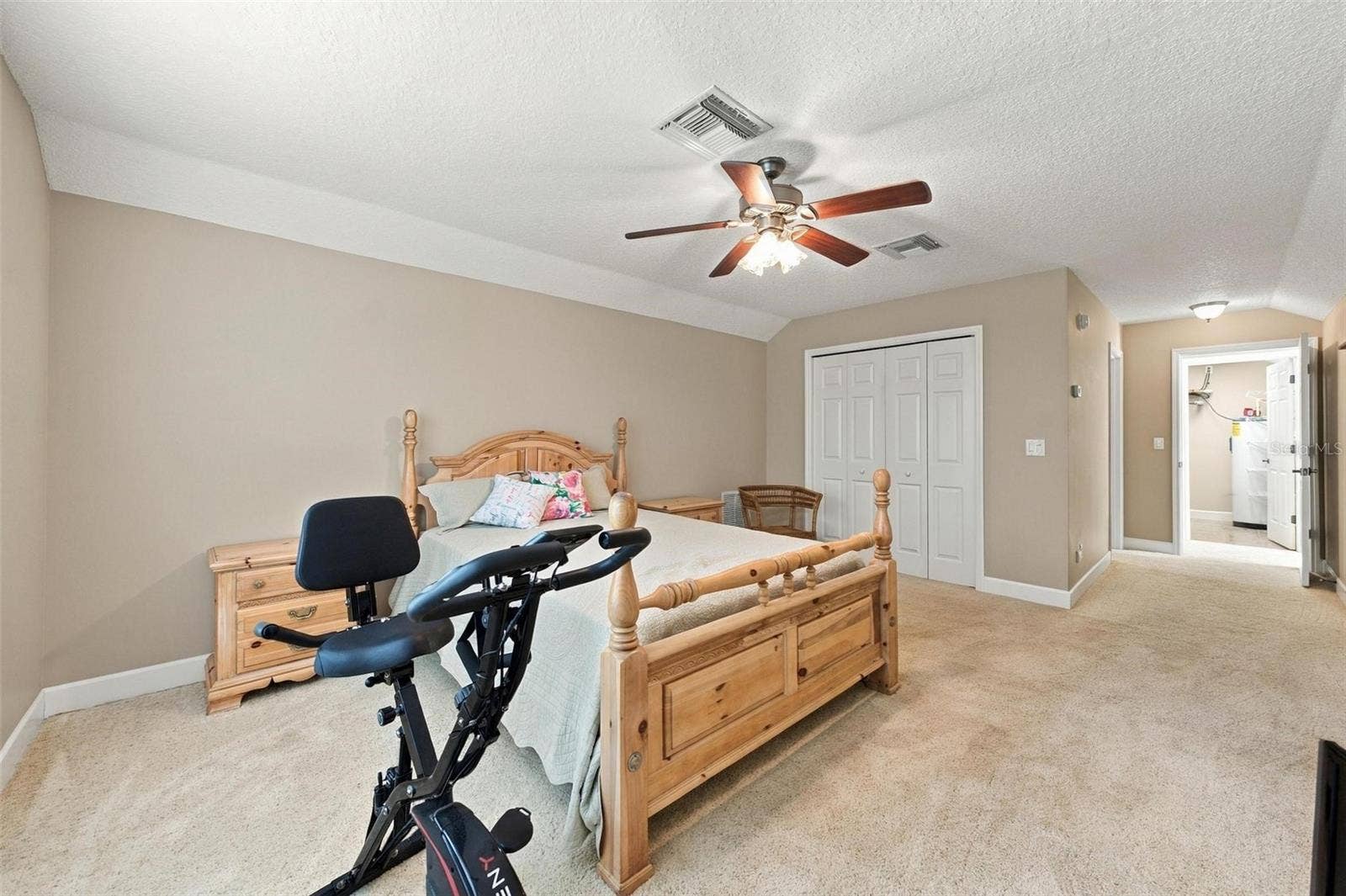 15330 SKY LAKE LANE, Tavares, FL 32778 INTERIOR VIEW OF UPSTAIRS PRIMARY SUITE