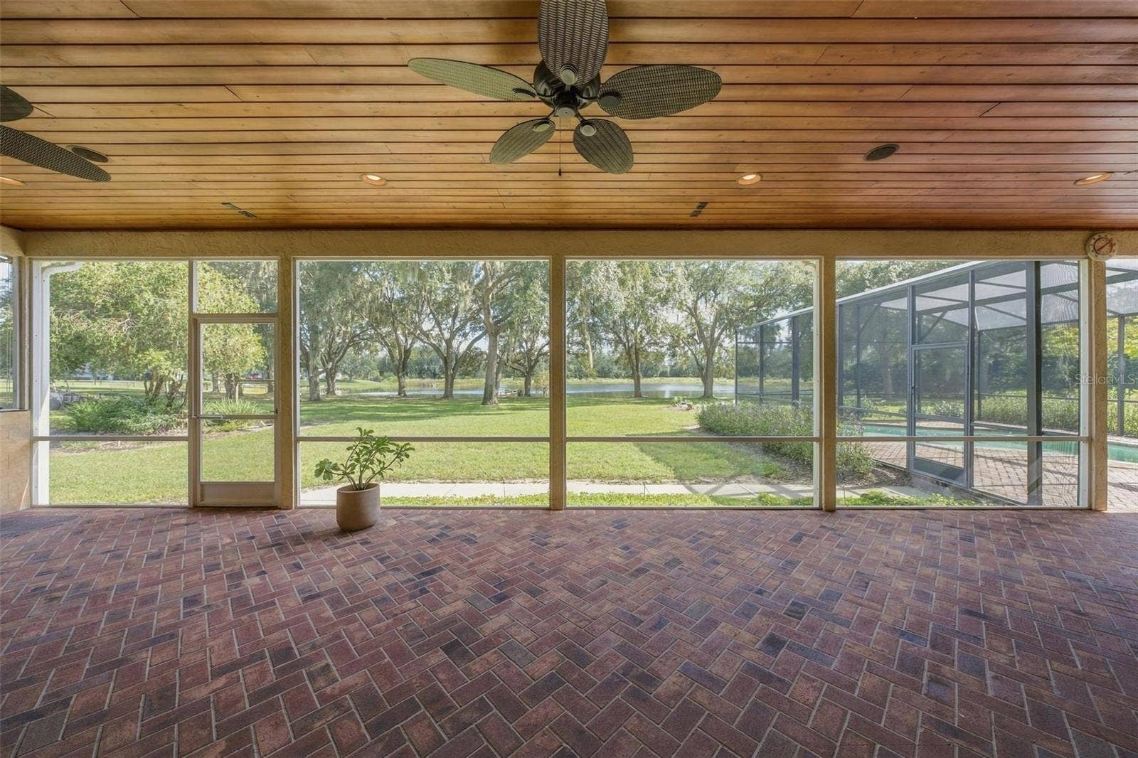 15330 SKY LAKE LANE, Tavares, FL 32778 HUGE LANAI WITH TONGUE & GROOVE WOOD CEILING OVERLOOKING THE PEACFUL LAND WITH LAKE VIEWS