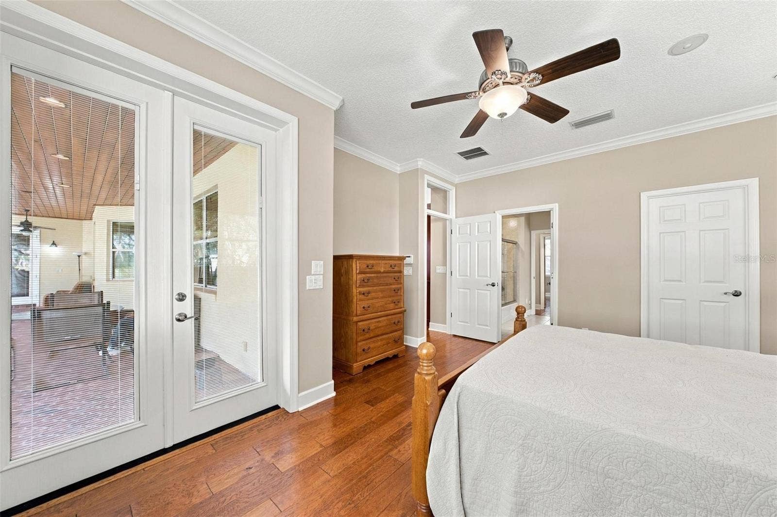 15330 SKY LAKE LANE, Tavares, FL 32778 2ND PRIMARY SUITE IN GUEST WING WITH FRENCH DOORS LEADING ONTO LANAI