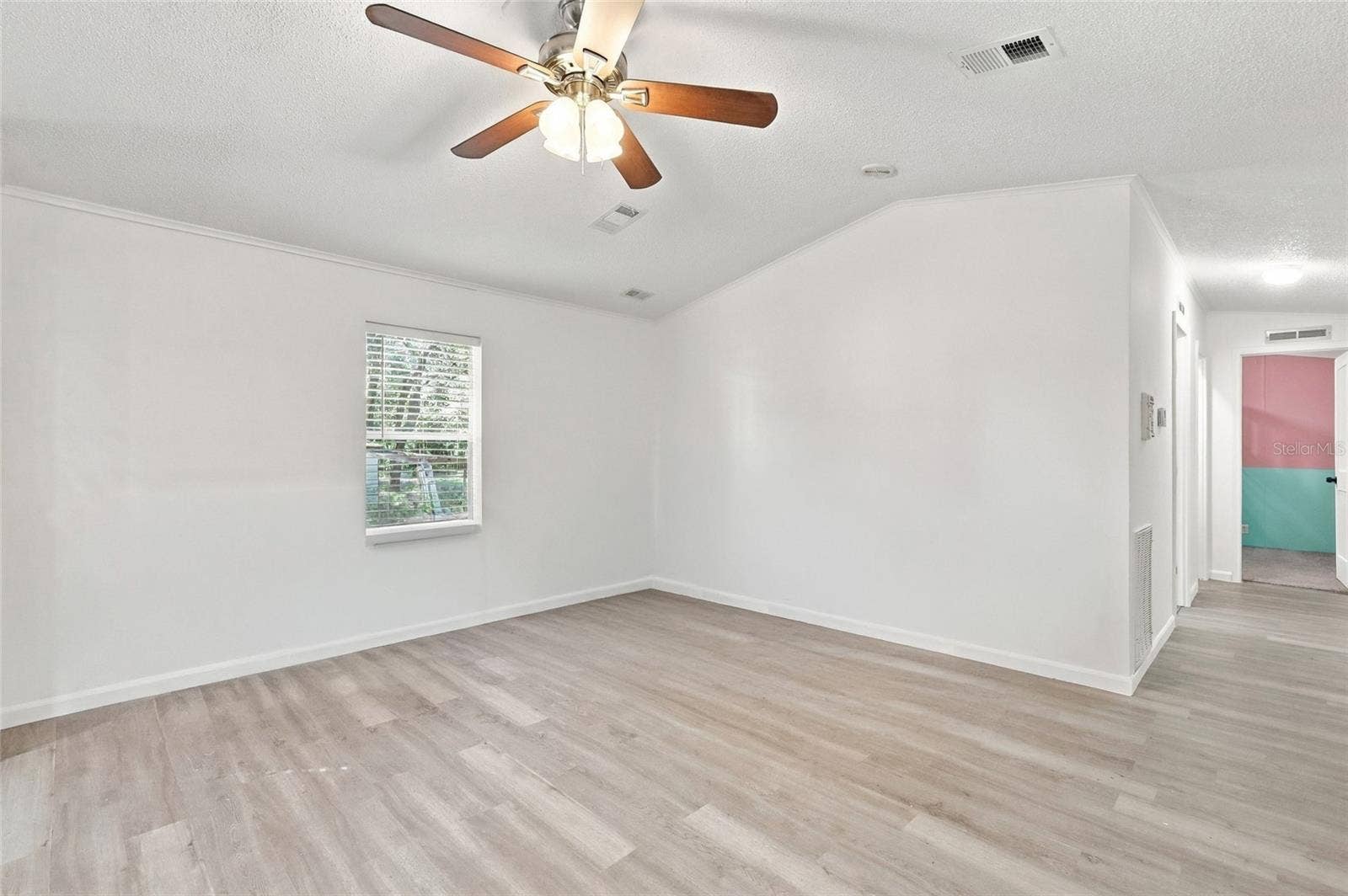 living room/ hallway to 2 guest bedrooms & guest bath