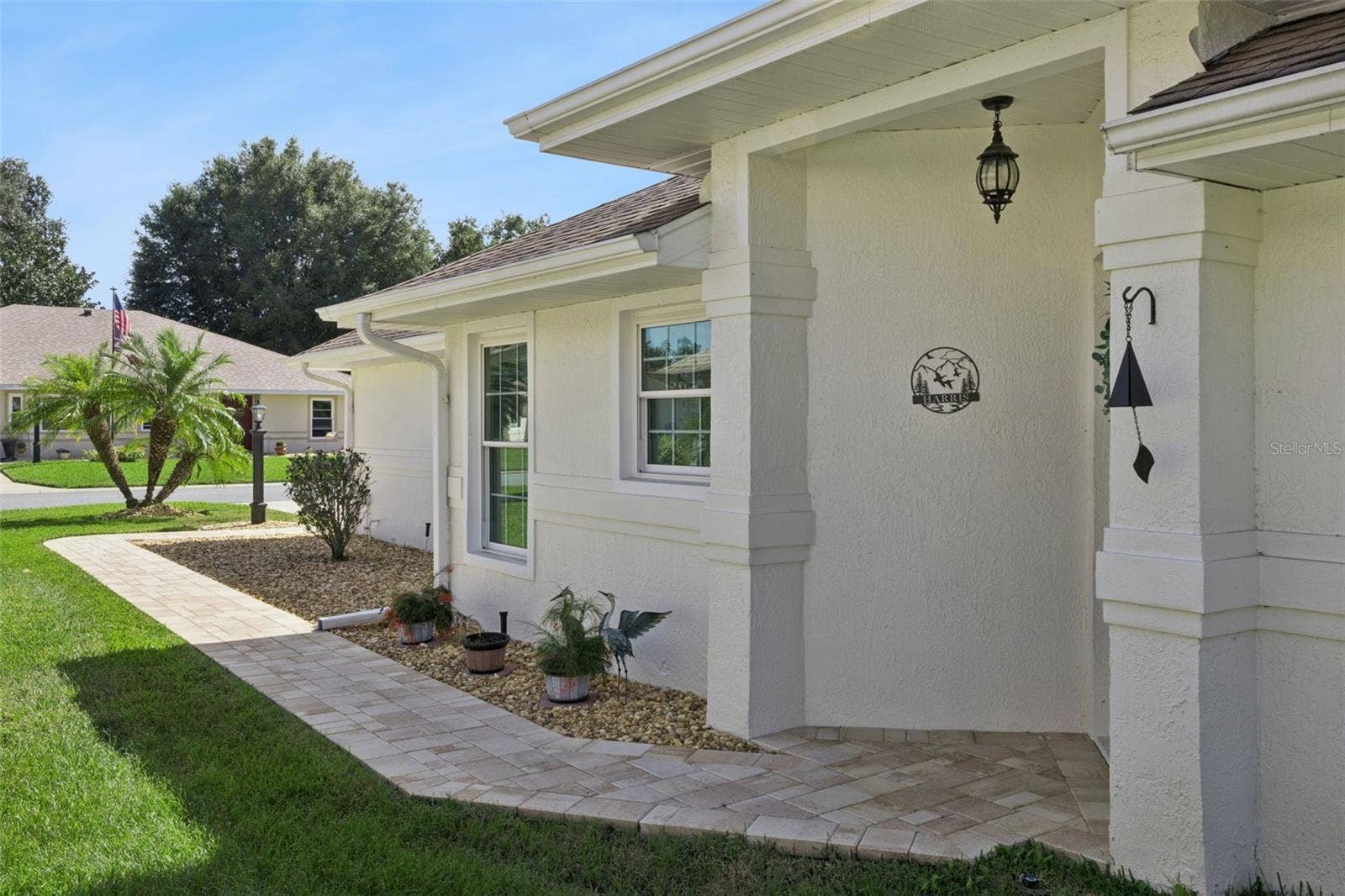 5853 PRINCESS CAROLINE PLACE, Leesburg, FL 34748 Side entry with paver walkway