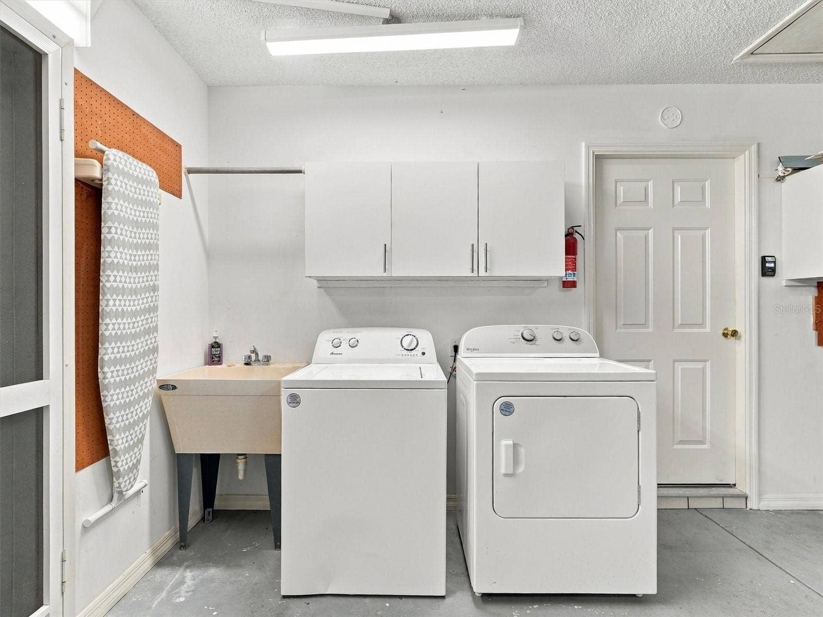 9892 SE 177TH LANE, Summerfield, FL 34491 Washer & Dryer, and Wash Tub - side door in garage