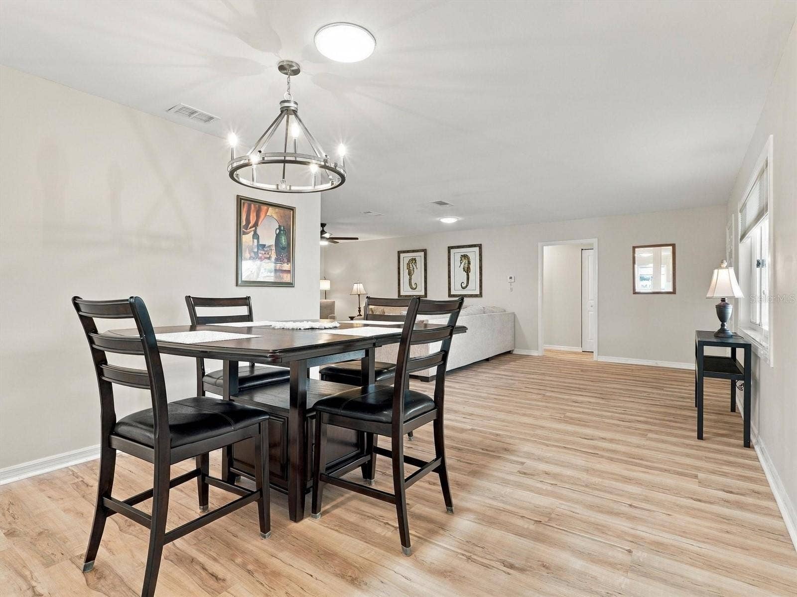 9892 SE 177TH LANE, Summerfield, FL 34491 Dining Room with Table for 4 and Solar Tube and New Light Fixture