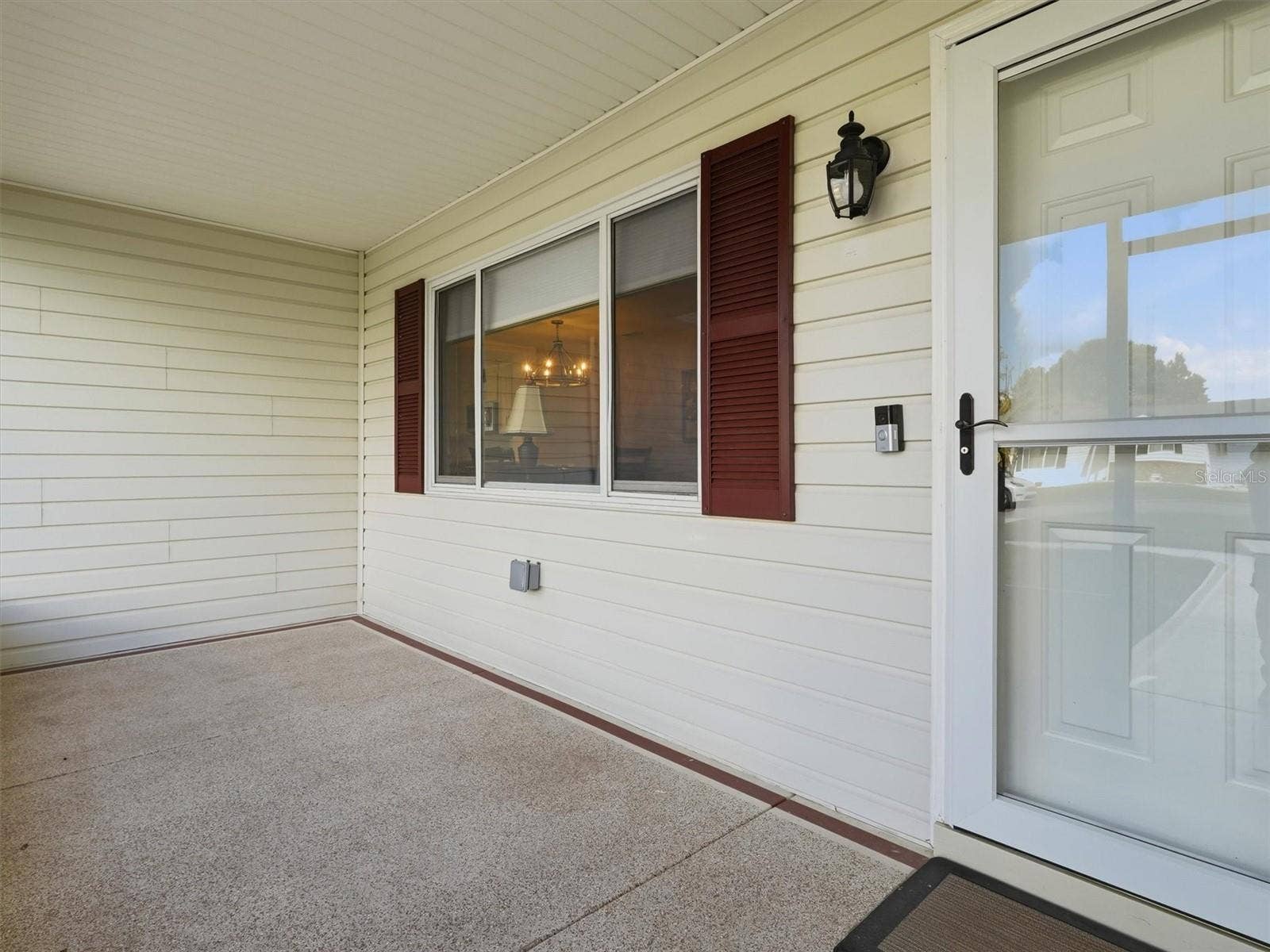 9892 SE 177TH LANE, Summerfield, FL 34491 Screened Front Porch with Custom Storm Door