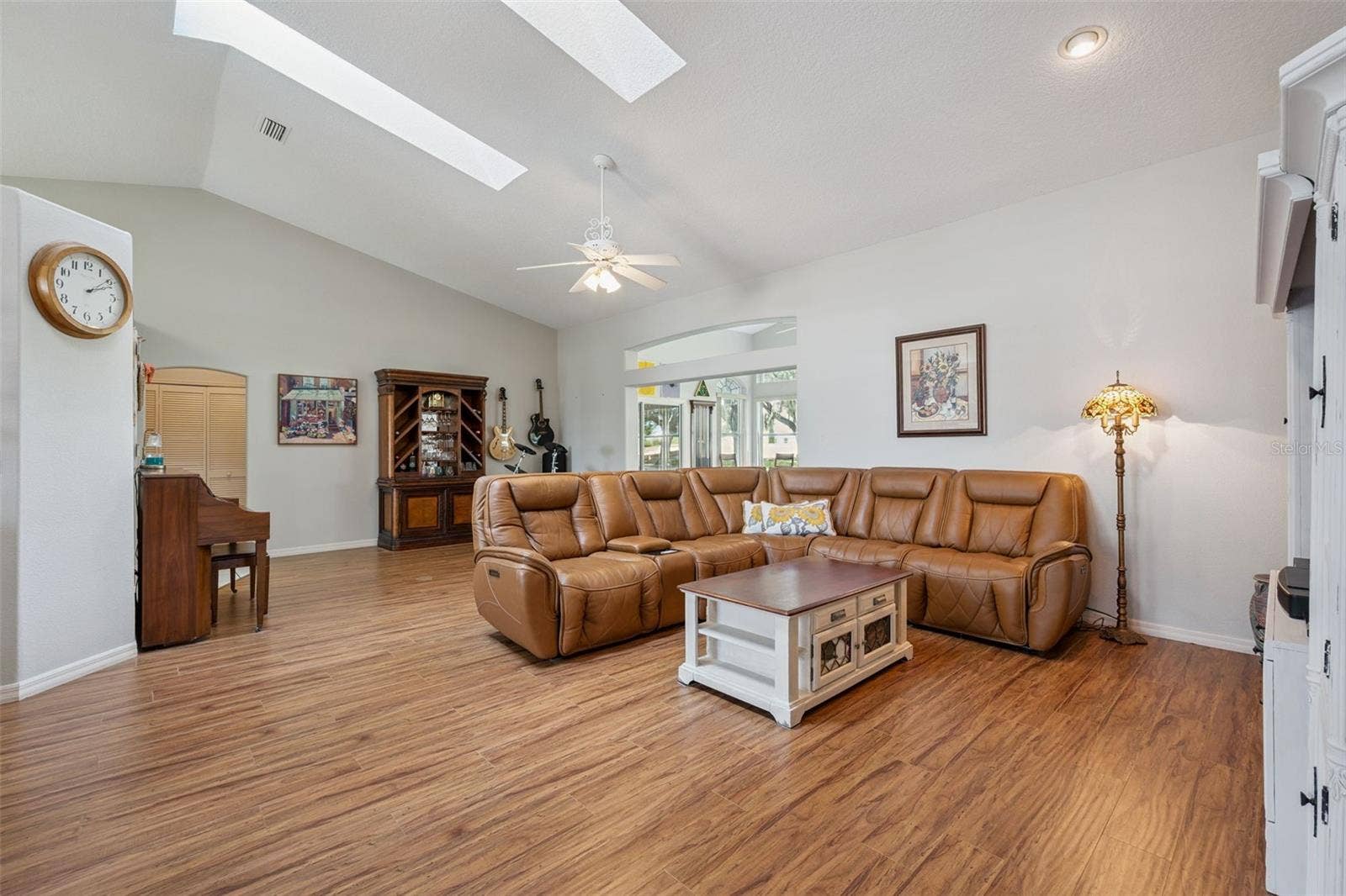 21113 EDINBOROUGH PLACE, Leesburg, FL 34748 Living Room with laminate floors