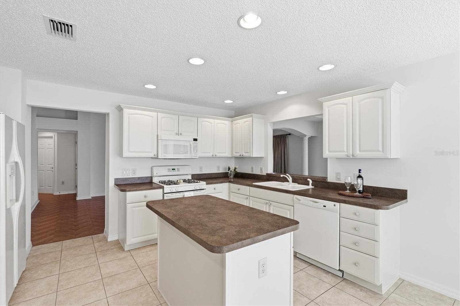 1563 EASTOVER TERRACE, The Villages, FL 32162 Large Kitchen with Lots of Cabinet and Prep Space, Tile floors.