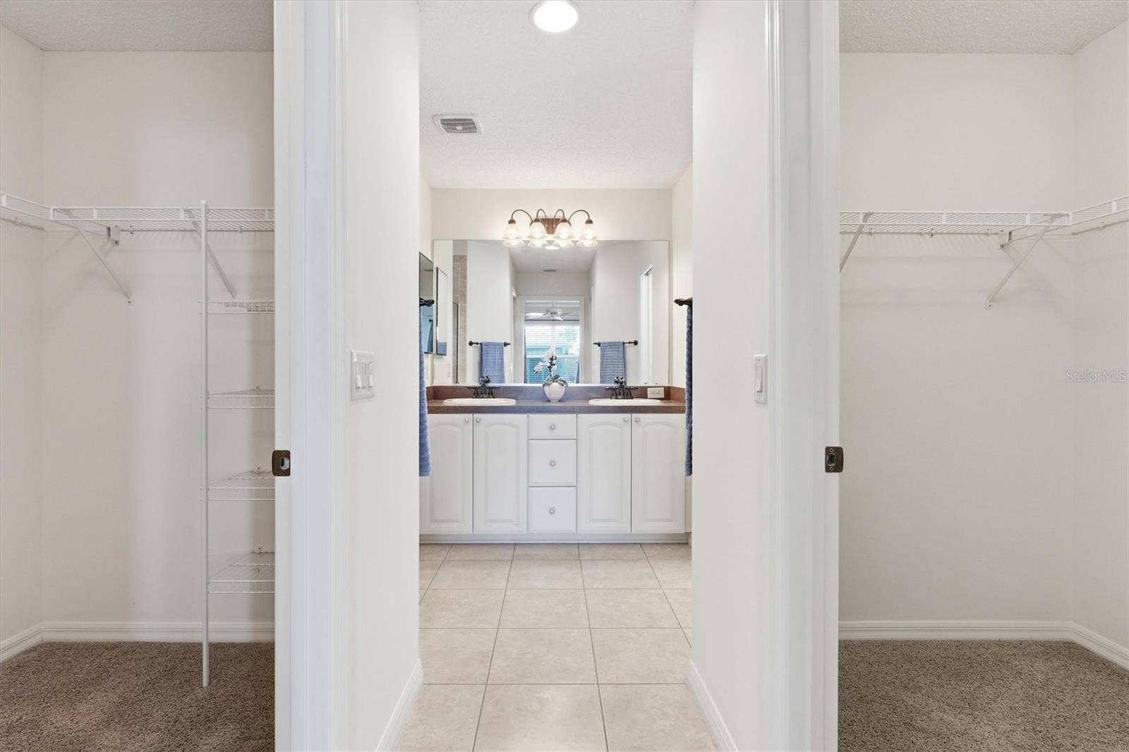 1563 EASTOVER TERRACE, The Villages, FL 32162 Primary Dual Walk In Closets going into the Primary En-Suite.