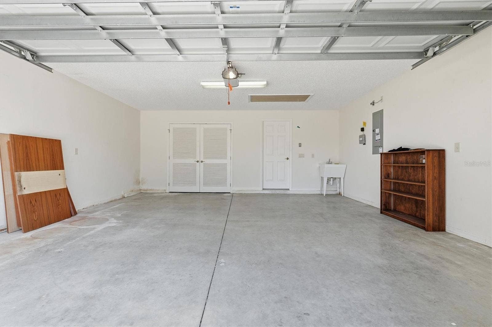 1563 EASTOVER TERRACE, The Villages, FL 32162 Two Car Garage, Wash Tub, Privacy Screen Sliding Door on Garage.