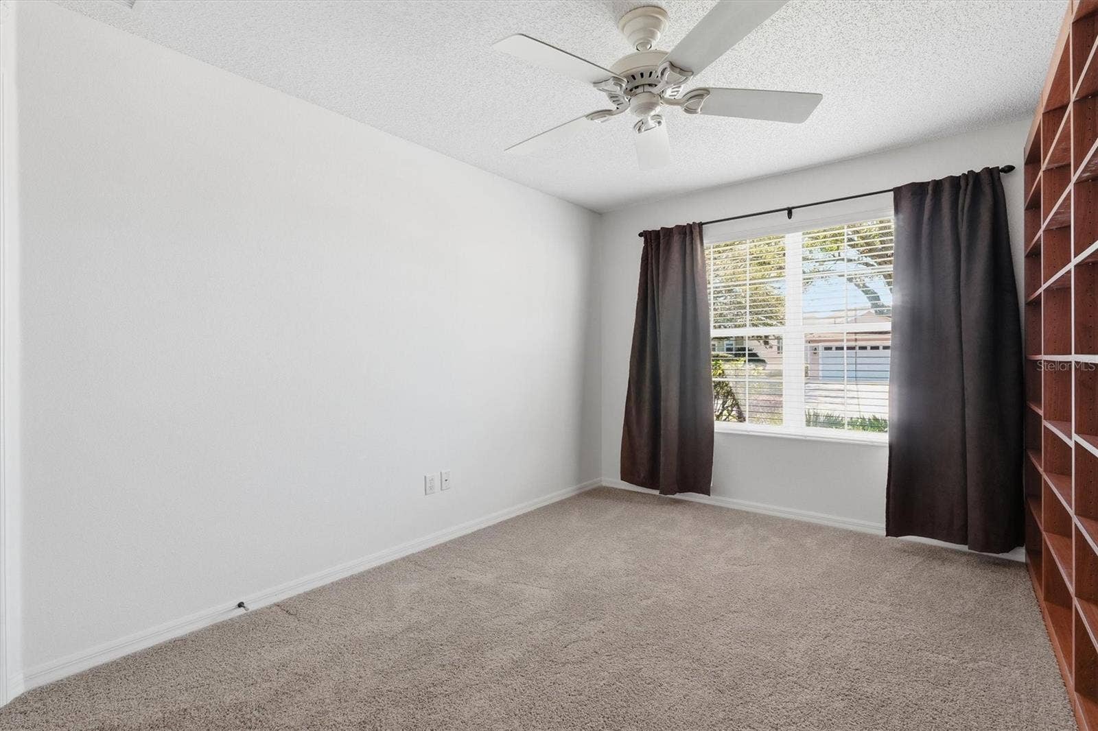 1563 EASTOVER TERRACE, The Villages, FL 32162 Bedroom #2 used as a Office or 2nd bedroom. Carpet and Ceiling Fan.