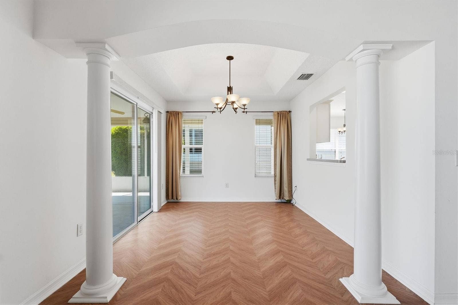 1563 EASTOVER TERRACE, The Villages, FL 32162 Dining room with the flooring continuing seamlessly.