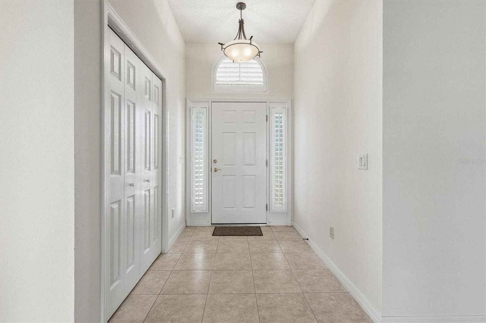 1563 EASTOVER TERRACE, The Villages, FL 32162 Foyer and Front Door with Coat Closet.