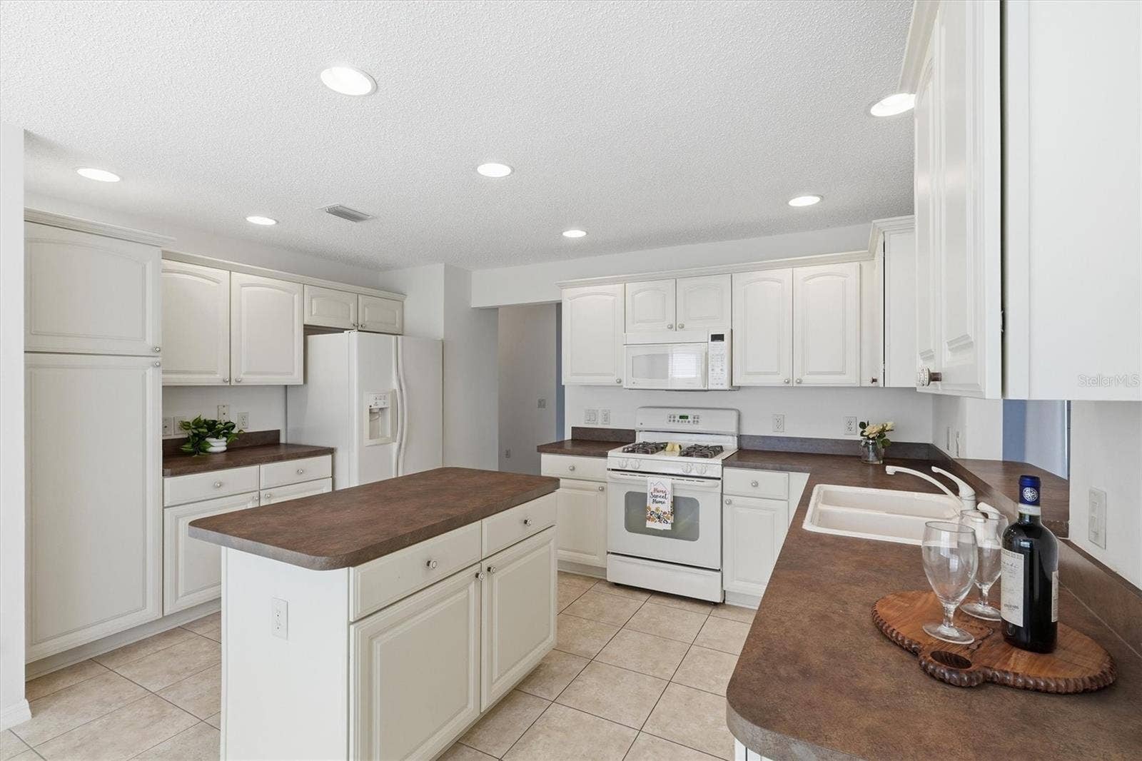 1563 EASTOVER TERRACE, The Villages, FL 32162 Kitchen Island with storage.