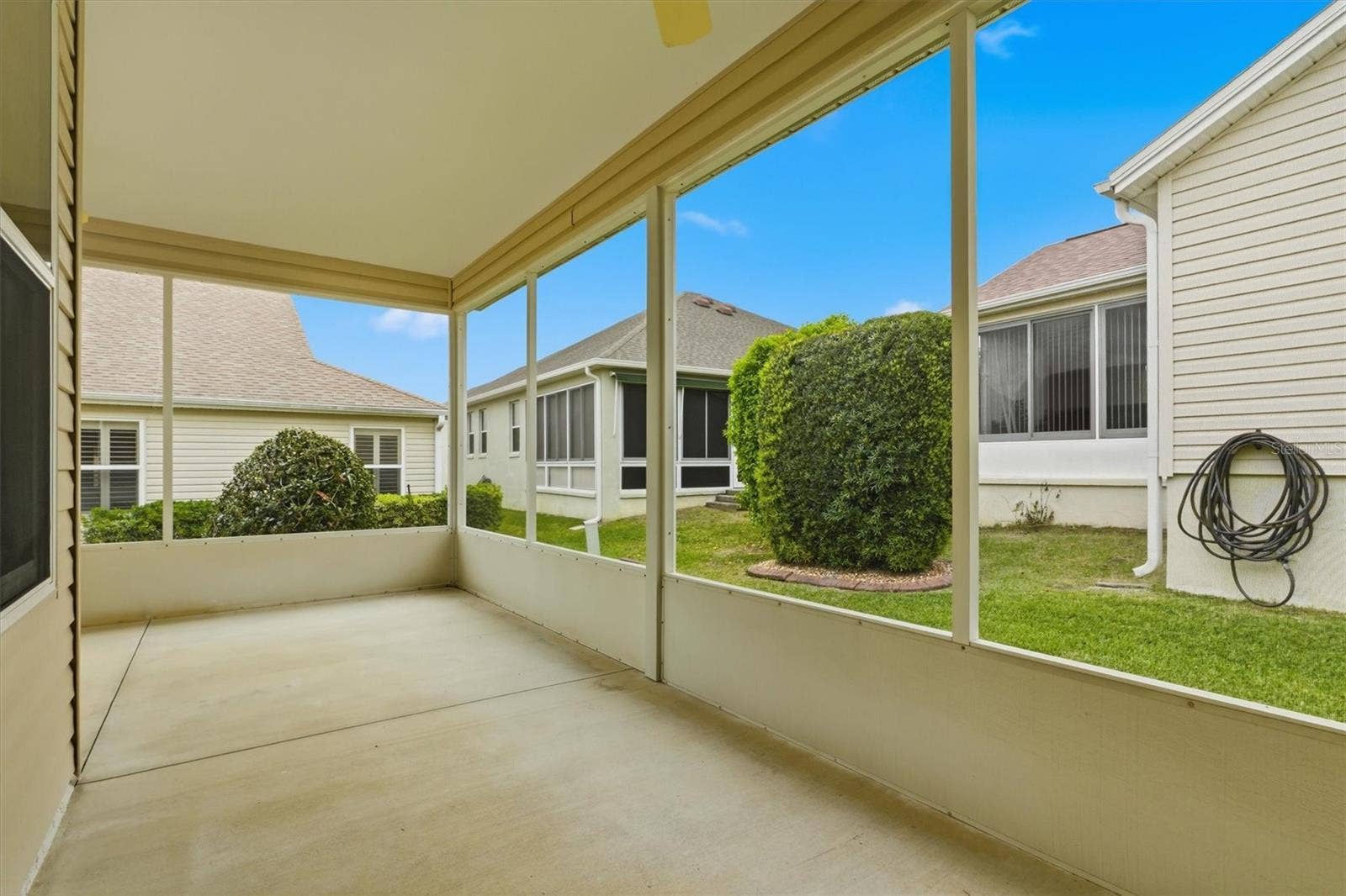 1563 EASTOVER TERRACE, The Villages, FL 32162 Screened Lanai wraps around the back of the house.