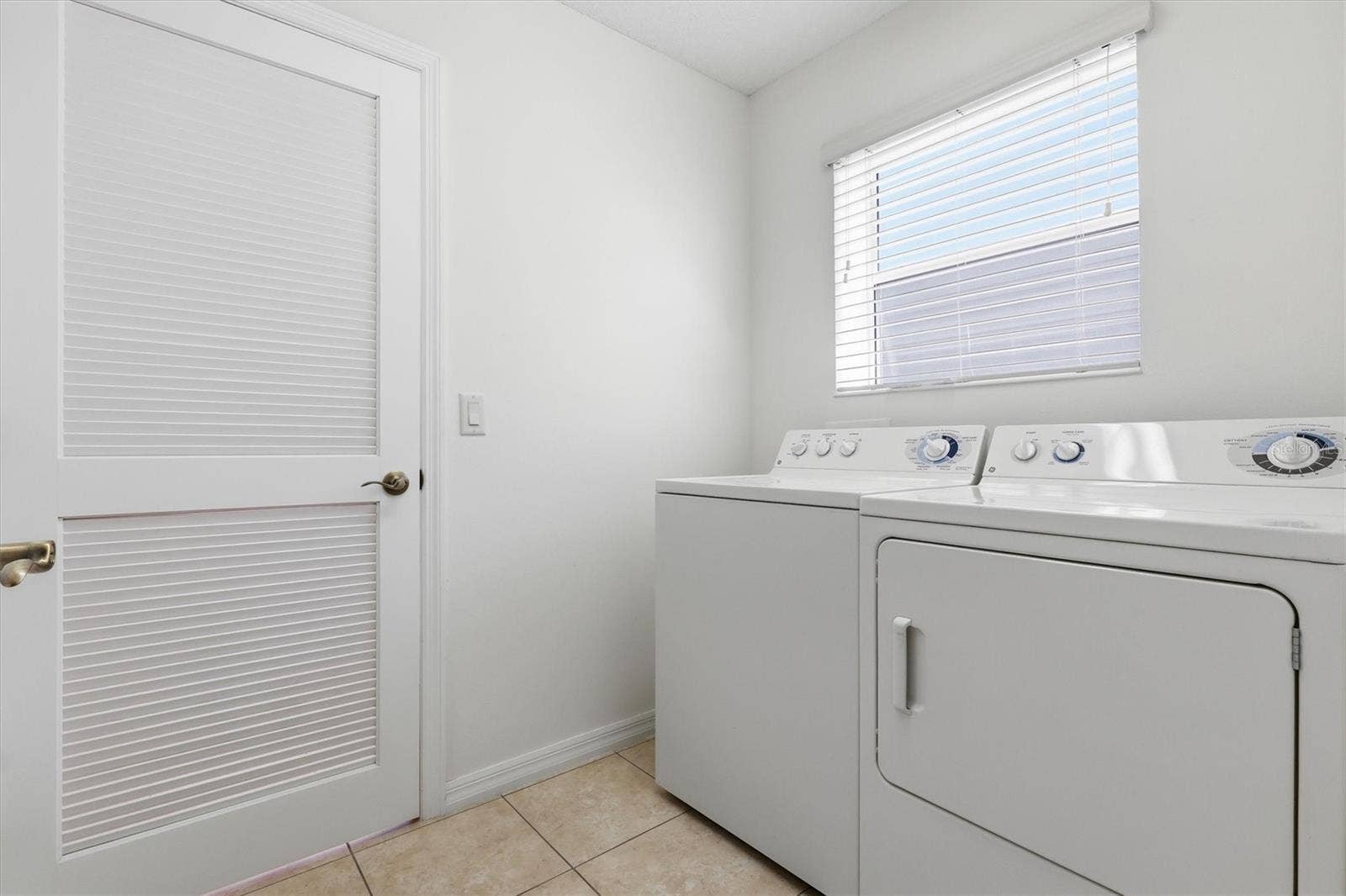 1563 EASTOVER TERRACE, The Villages, FL 32162 Two Car Garage, Wash Tub, Privacy Screen Sliding Door on Garage.