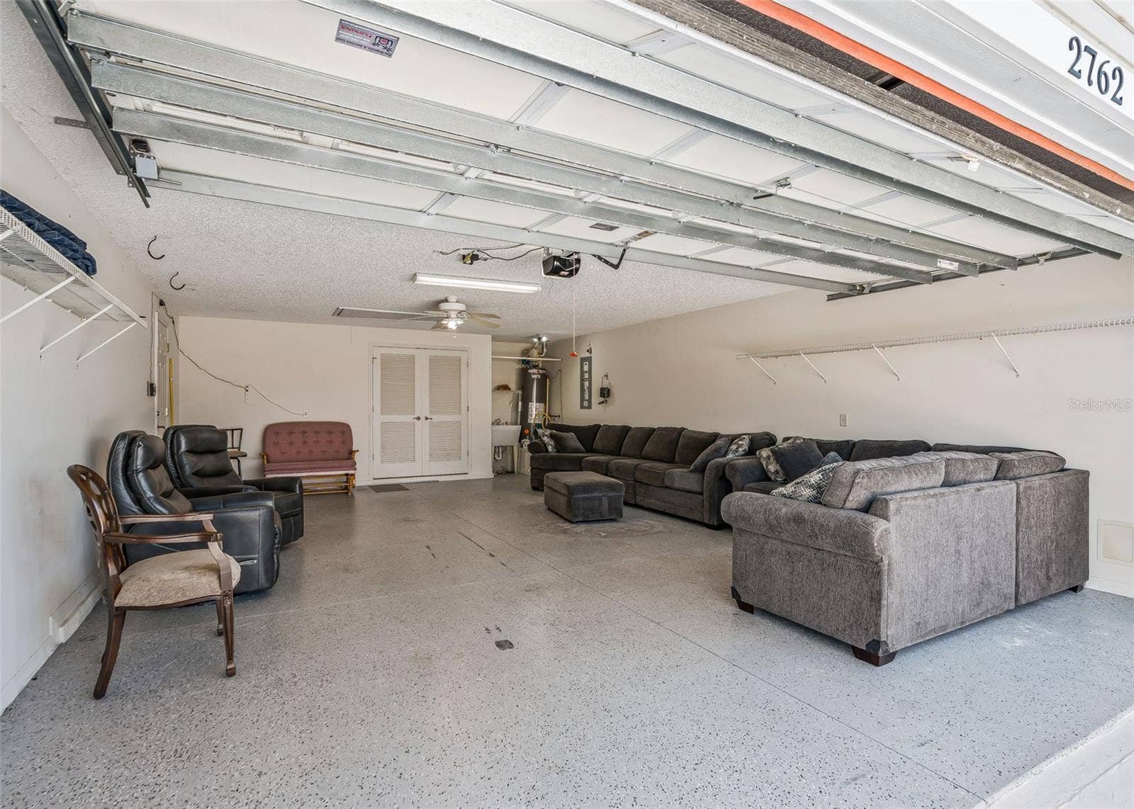2762 MORVEN PARK WAY, The Villages, FL 32162 EXTENDED 2 Car Garage w/ Epoxy Flooring. 20'x29'