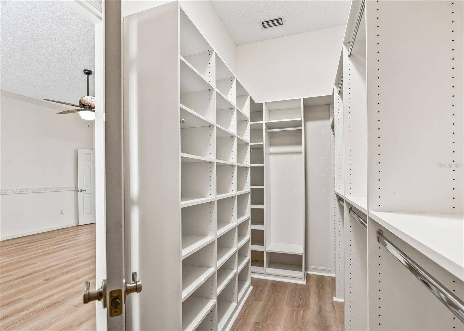 2762 MORVEN PARK WAY, The Villages, FL 32162 Primary Walk-In Closet w/ Organizers & Solar Tube.