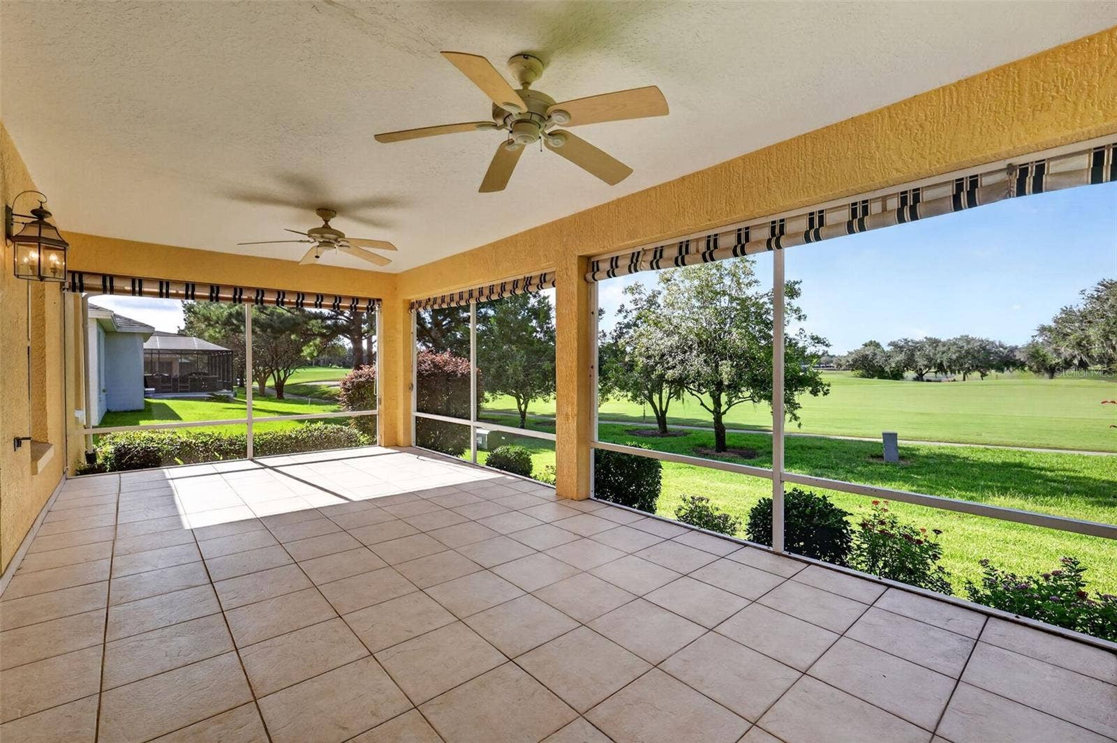 16840 SE 85TH SAPELO COURT, The Villages, FL 32162 Spacious Lanai with GOLF and WATER VIEWS!