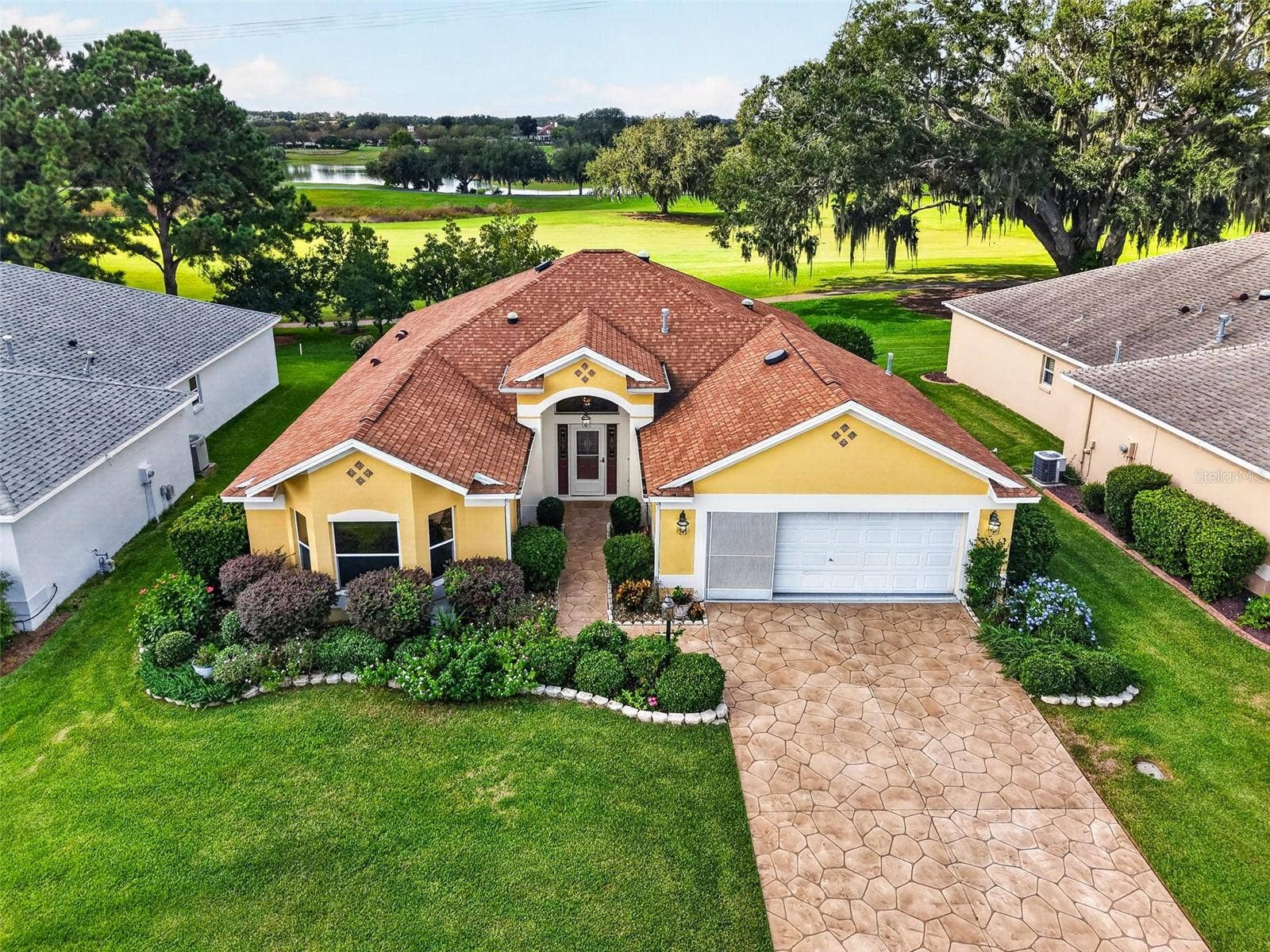 16840 SE 85TH SAPELO COURT, The Villages, FL 32162 Aerial Front Elevation with GOLF and WATER VIEWS!