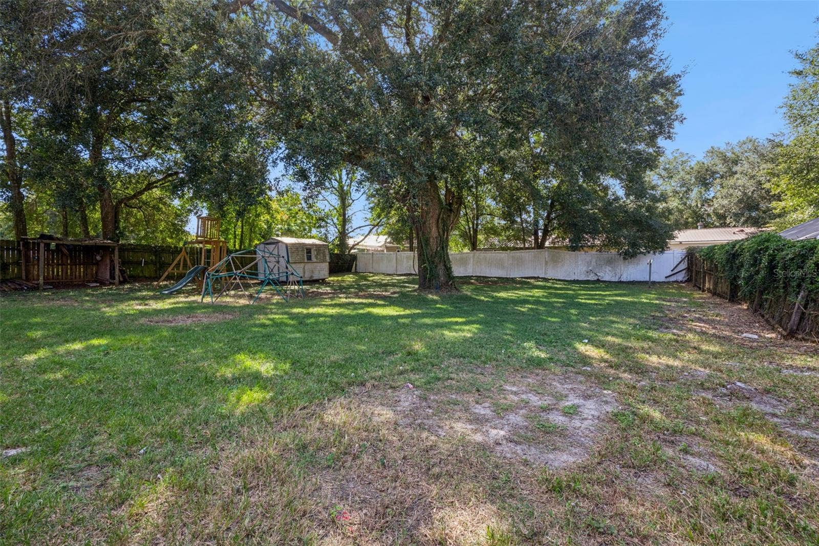 416 WINNERS CIRCLE, Lady Lake, FL 32159 Drive gate leads to back yard - so many possibilities here!