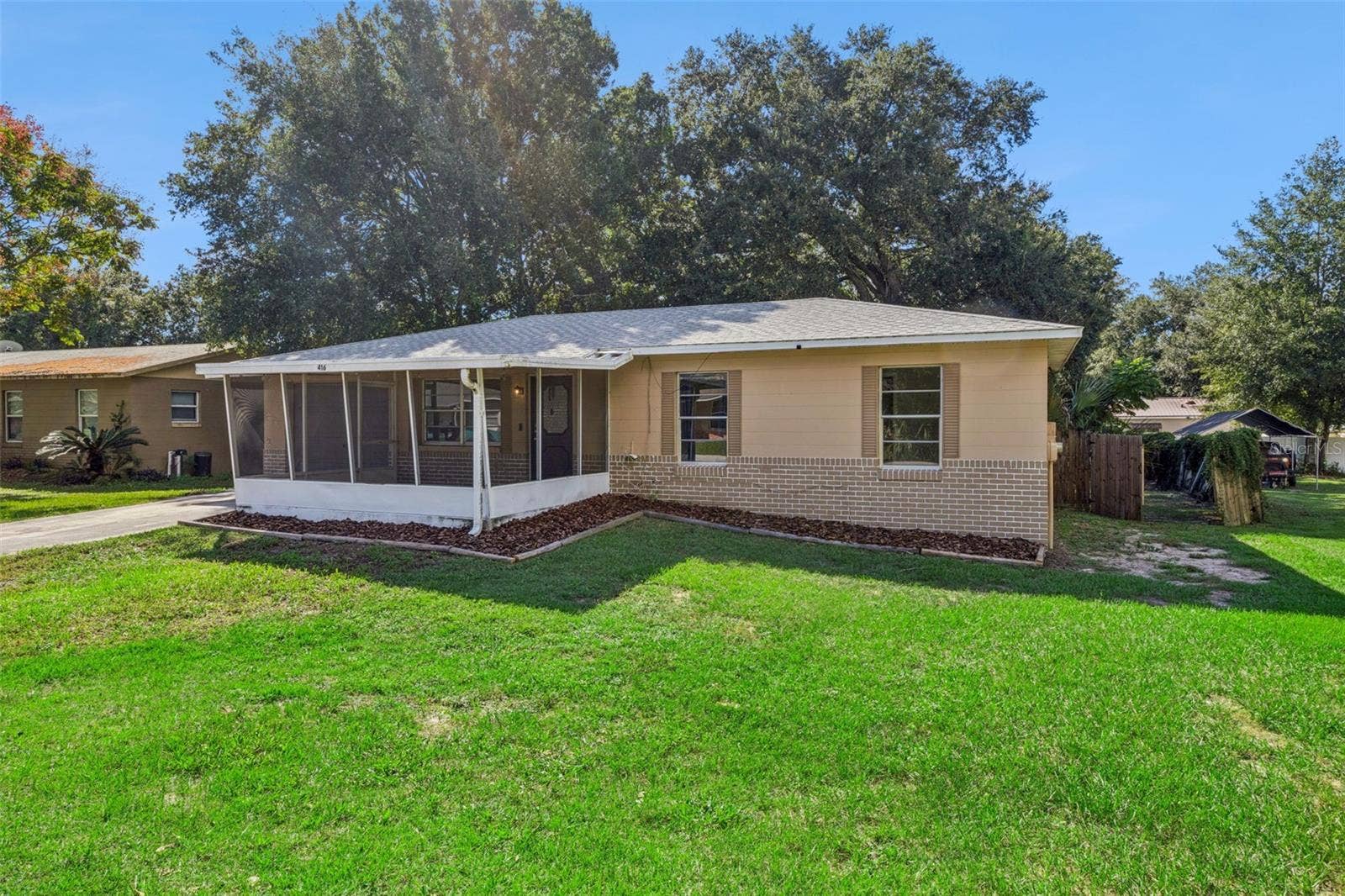 416 WINNERS CIRCLE, Lady Lake, FL 32159 Block home with brick accents.