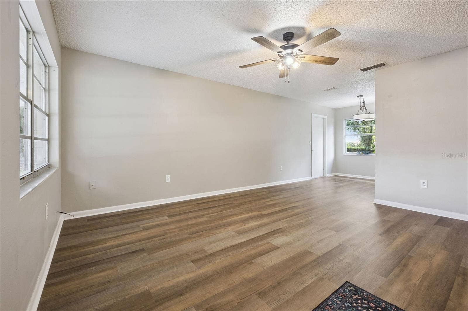 416 WINNERS CIRCLE, Lady Lake, FL 32159 Living Room flows to Kitchen Dining.