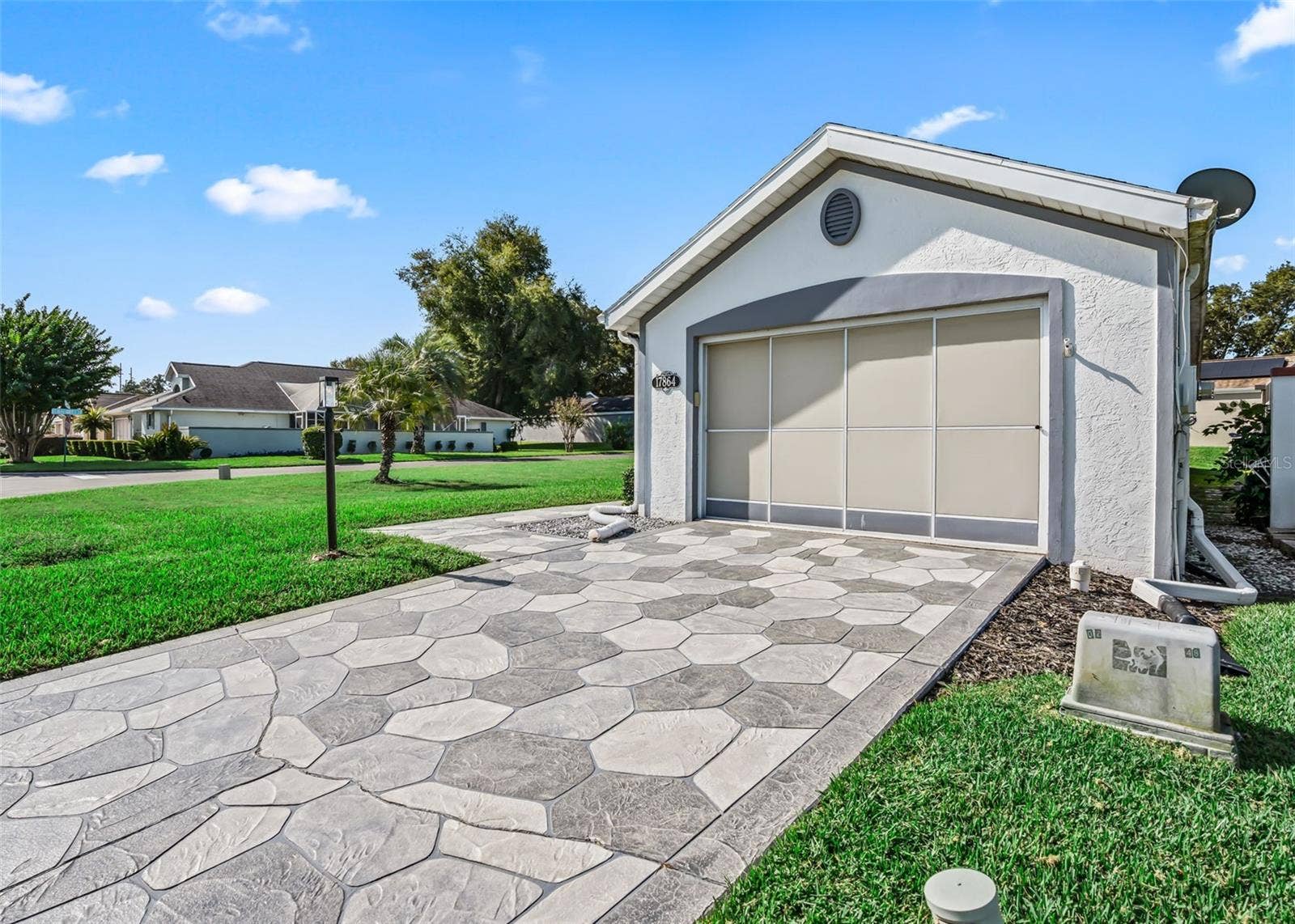 17864 SE 115TH COURT, Summerfield, FL 34491 Garage will have a new black ceiling fan this week.