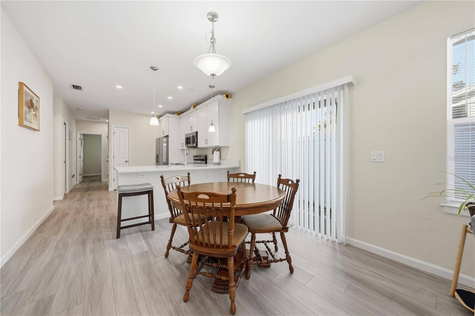 1911 VIRGINIA AVENUE, Eustis, FL 32726 Dining area with sliding doors to the side yard