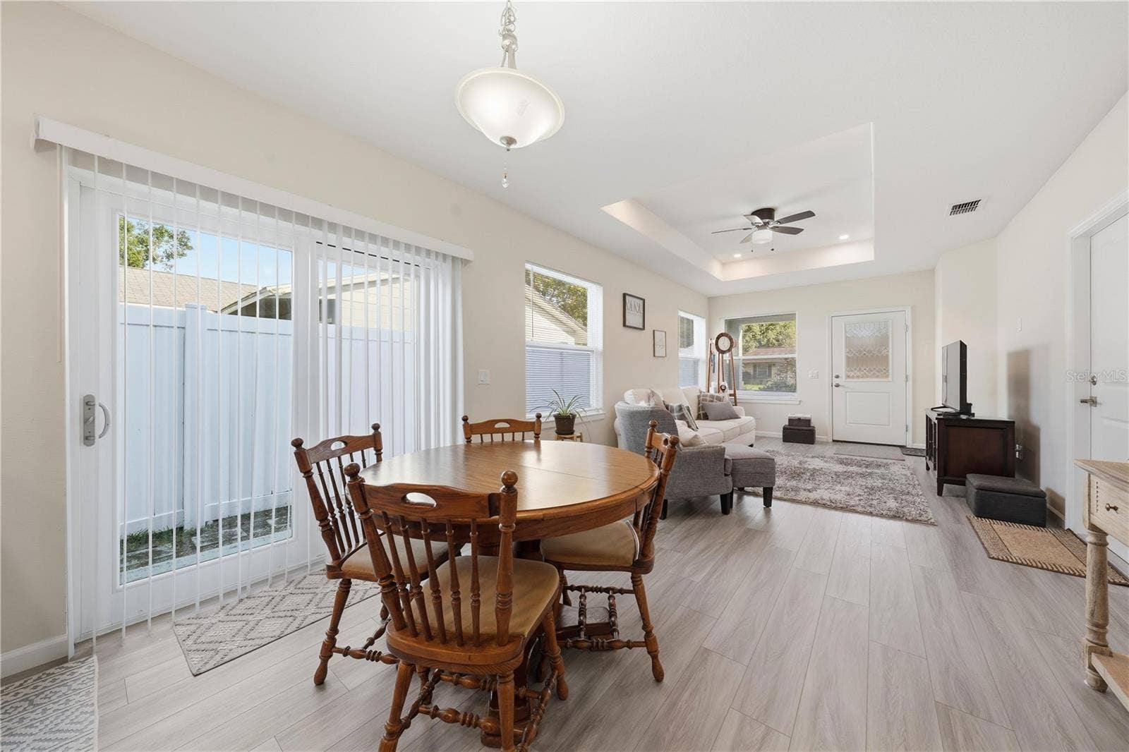 1911 VIRGINIA AVENUE, Eustis, FL 32726 dining area and great room with sliding doors to the side yard
