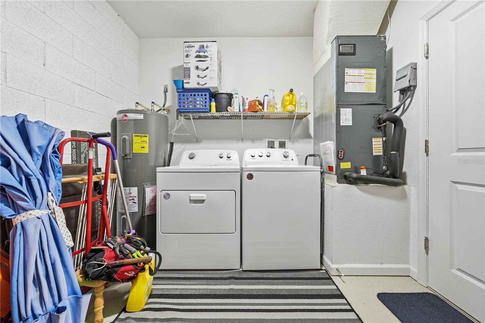 1911 VIRGINIA AVENUE, Eustis, FL 32726 laundry area in garage
