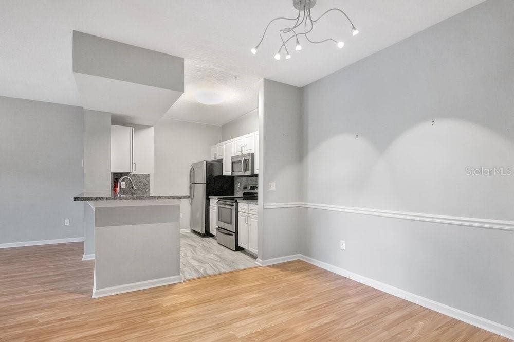 14238 FREDRICKSBURG DRIVE, #304, Orlando, FL 32837 Dining into Kitchen