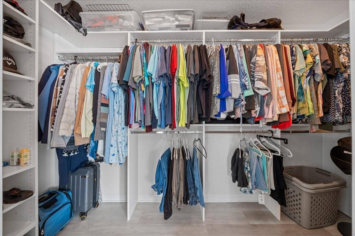 Large Walk-in Closet with Customized Shelving