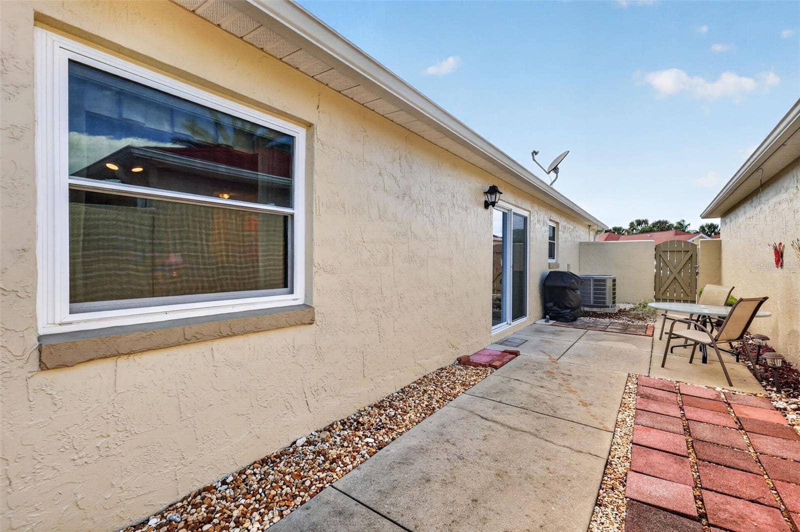 407 CARMEL AVENUE, The Villages, FL 32159 Spacious 45'x11' PRIVATE Side Courtyard and Rear Stoned Yard