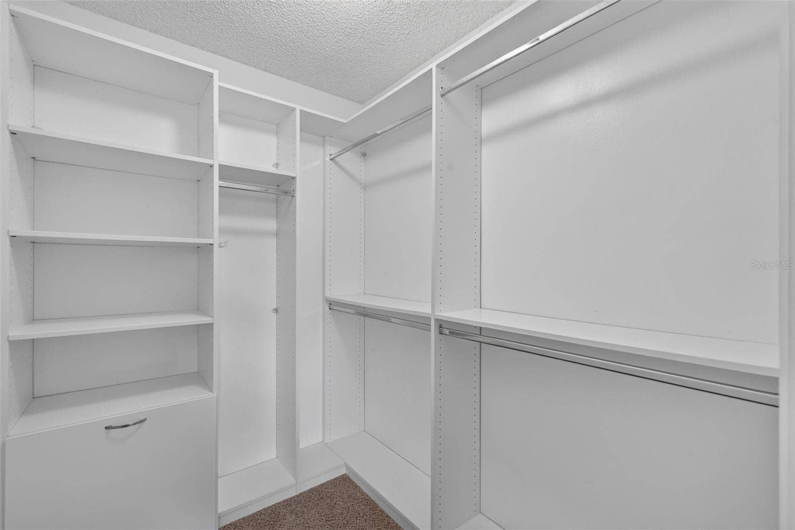 407 CARMEL AVENUE, The Villages, FL 32159 Primary Bedroom Custom Walk-In Closet