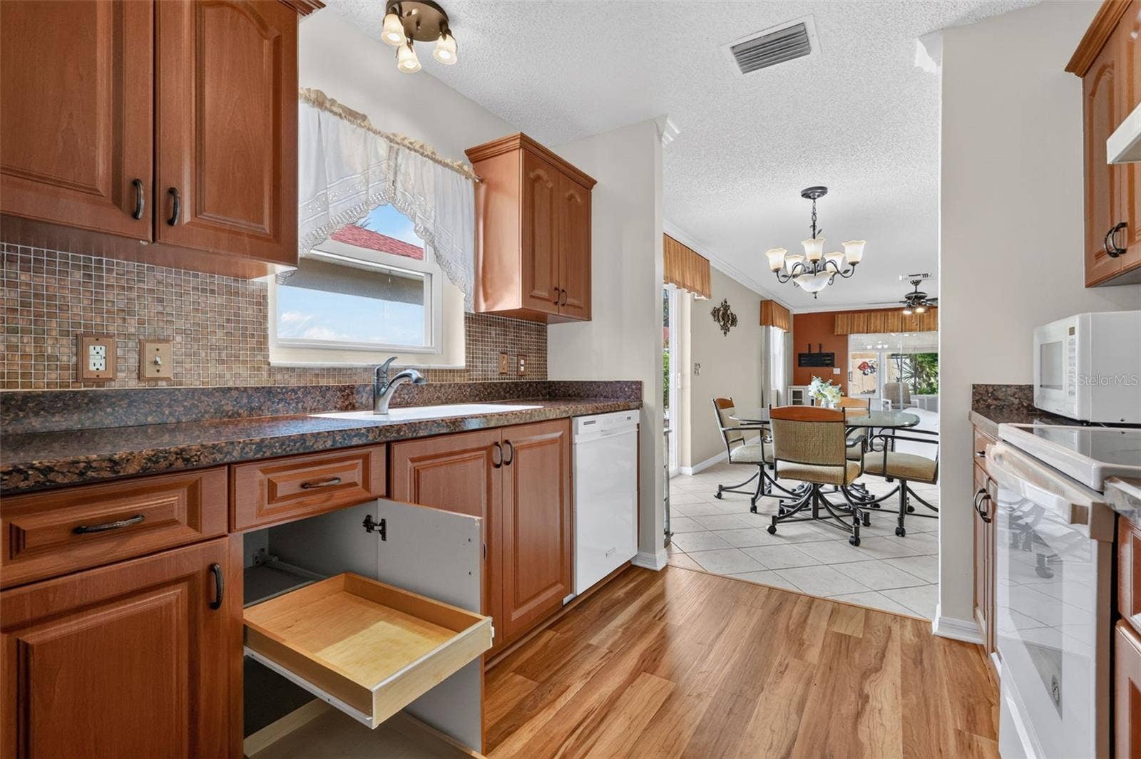 407 CARMEL AVENUE, The Villages, FL 32159 Kitchen with Roll-Out Shelving