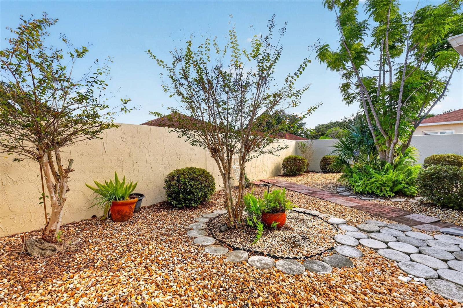 407 CARMEL AVENUE, The Villages, FL 32159 Rear Stoned Yard- NO GRASS!