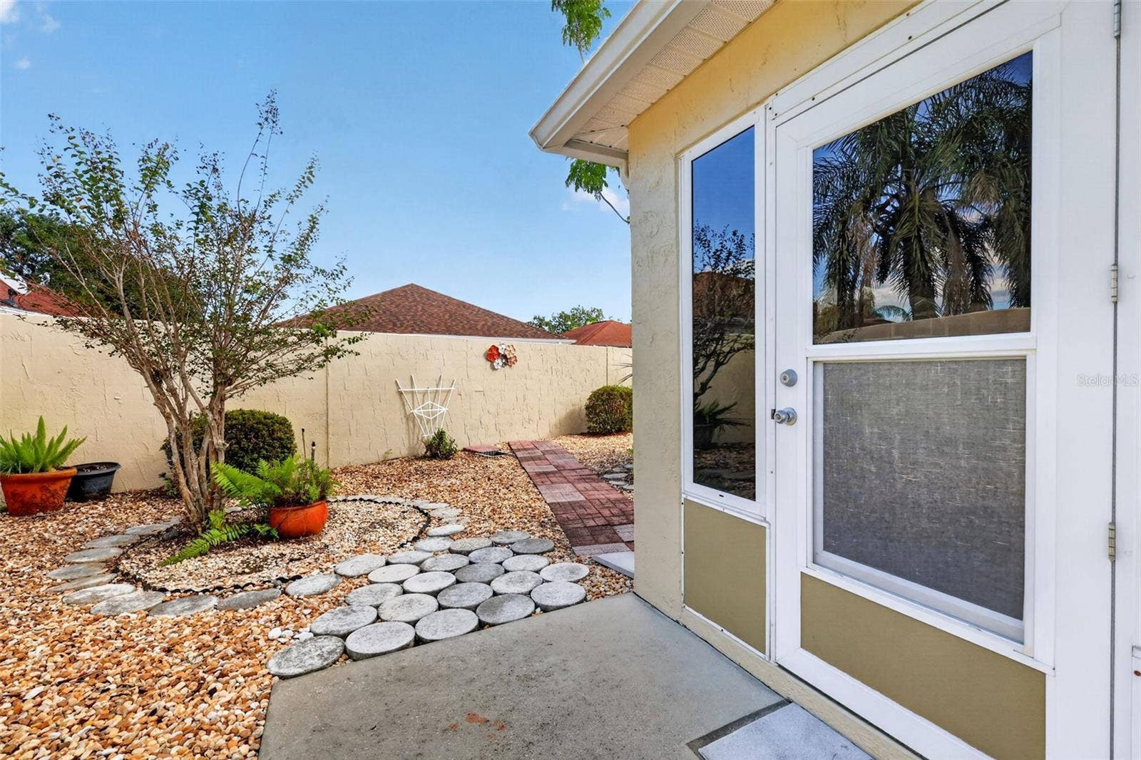 407 CARMEL AVENUE, The Villages, FL 32159 Rear Stoned Yard- NO GRASS!