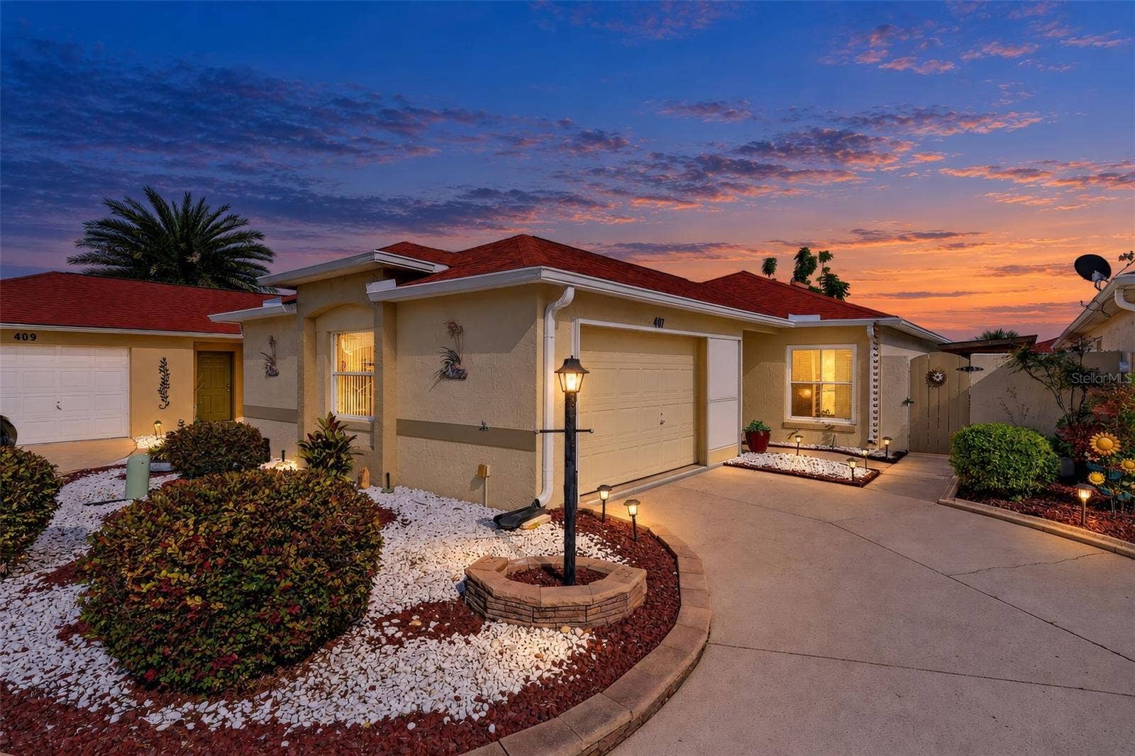 407 CARMEL AVENUE, The Villages, FL 32159 Twilight Front Elevation