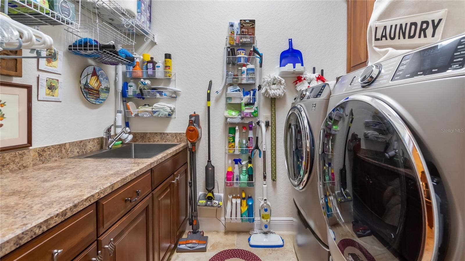 Laundry Room with Cabinetry and Sink