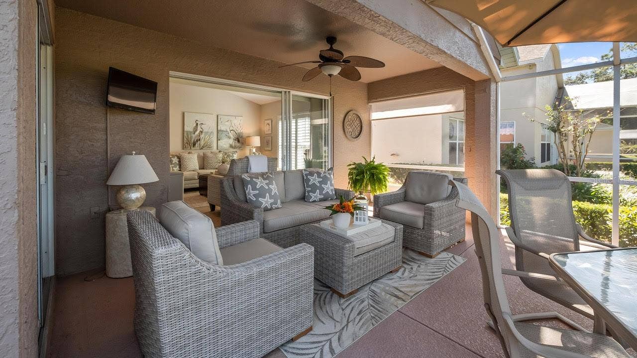 3720 DOUNE WAY, Clermont, FL 34711 Relaxing Area on the Lanai Overlooking the Golf Course