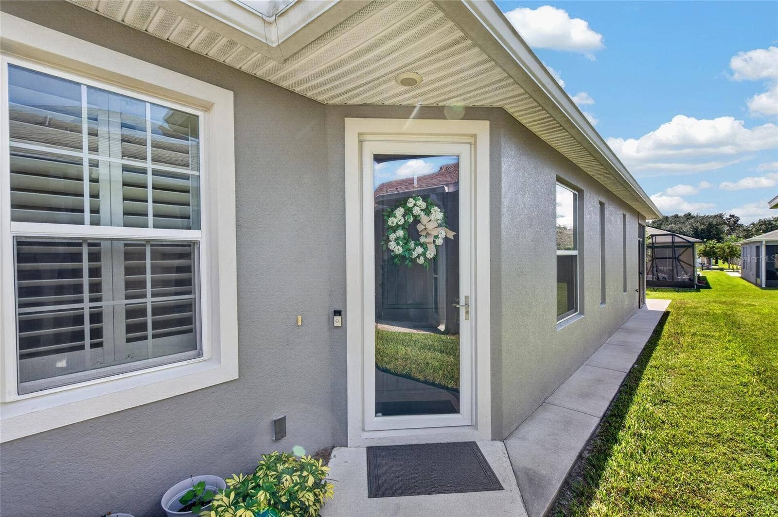 4408 BEDFORD WAY, Leesburg, FL 34748 Entry way with storm/screen door